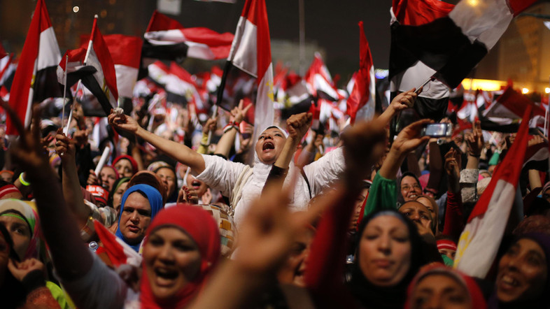 Protesters, who are against Egyptian President Mohamed Mursi, react in Tahrir Square in Cairo