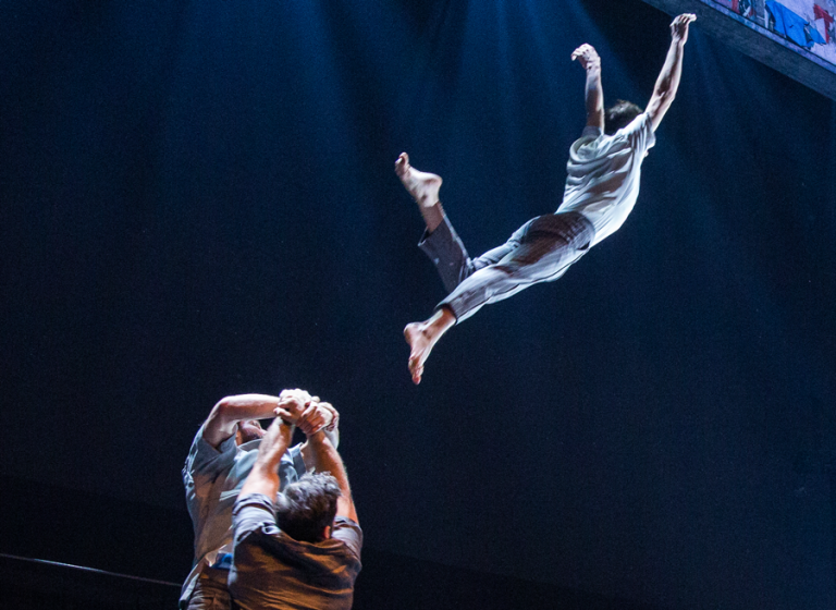 The 7 Fingers performers flying through the air