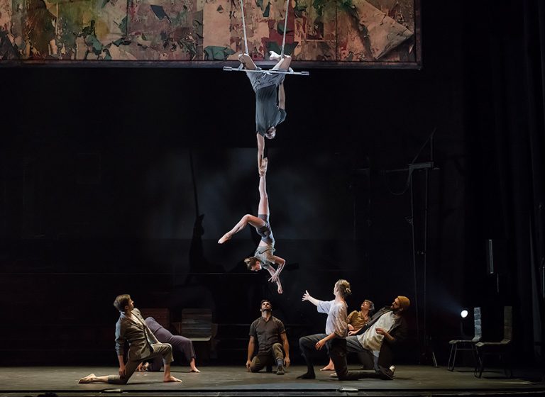 The 7 Fingers performers balancing on each other