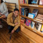 Christopher Rivas with his book at a local bookstore