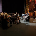 The crowd and panel, including David Howse, at Keeping The Charge. Image shot from the side.