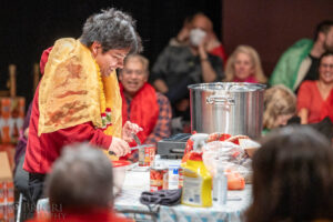 Audience member opening up cans for the dahl