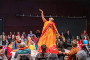 Mrs. Krishnan dancing on a table