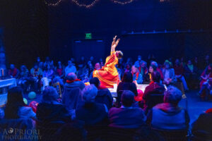 Mrs. Krishnan dancing on a table