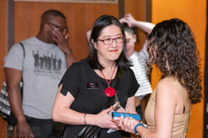 Susan Chinsen greeting an audience member