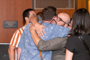 Kevin Becerra hugging Darren DeLuca