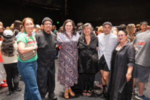 Members of Prison Dancer's creative team posing for a photo with ArtsEmerson staff