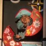 Puppet with colorful paper fans