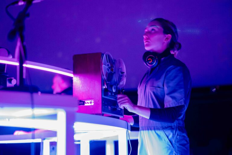 Planetarium interior with company member