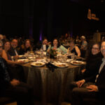 Attendees sitting at their banquet table