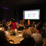 Attendees sitting at their banquet table