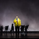 Weatherman in bright yellow coat