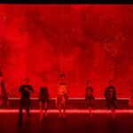 The Seasons cast with a red background