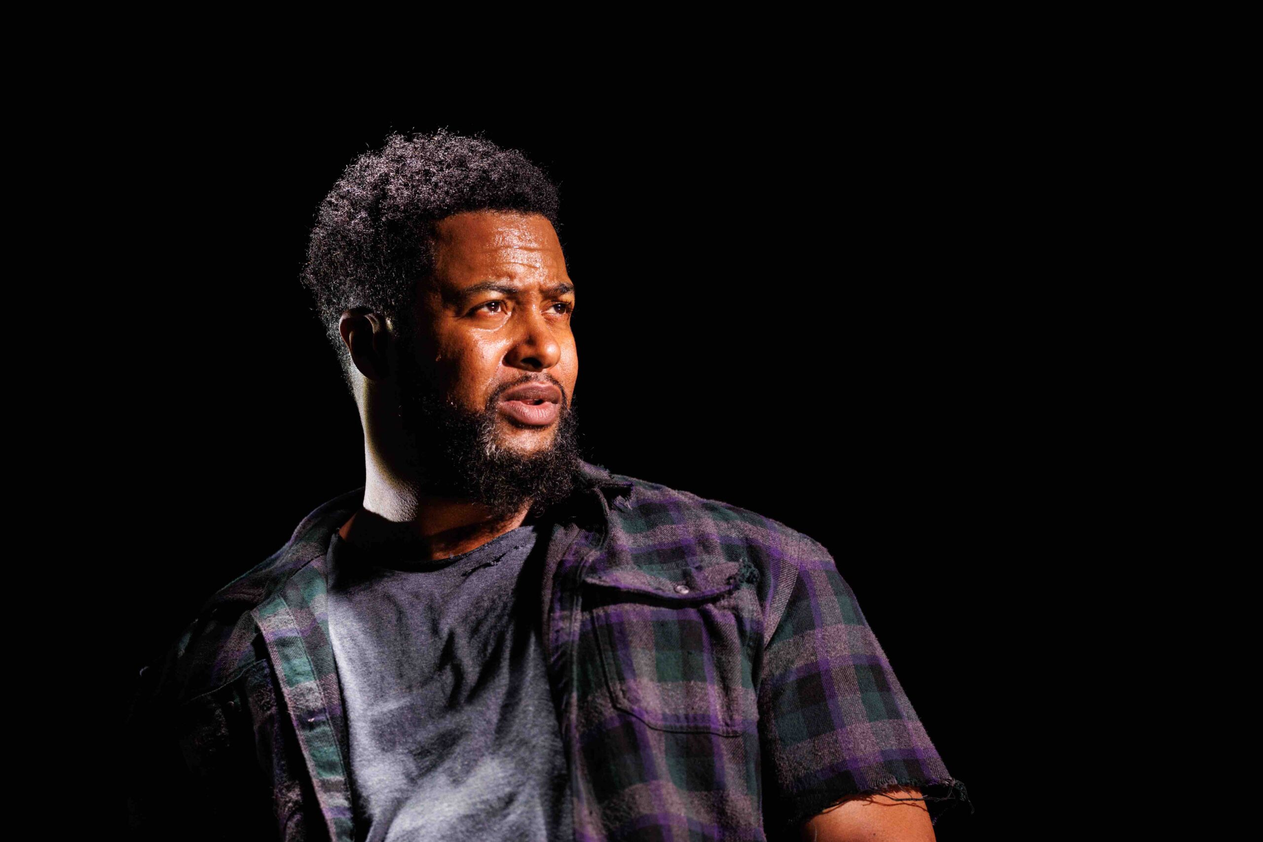 Hang Time Image of 3 black male looking towards the right