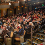 Audience sitting in the orchestra level