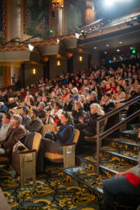 Audience sitting in the orchestra level