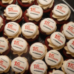 Cupcakes with "15th anniversary ArtsEmerson" on them
