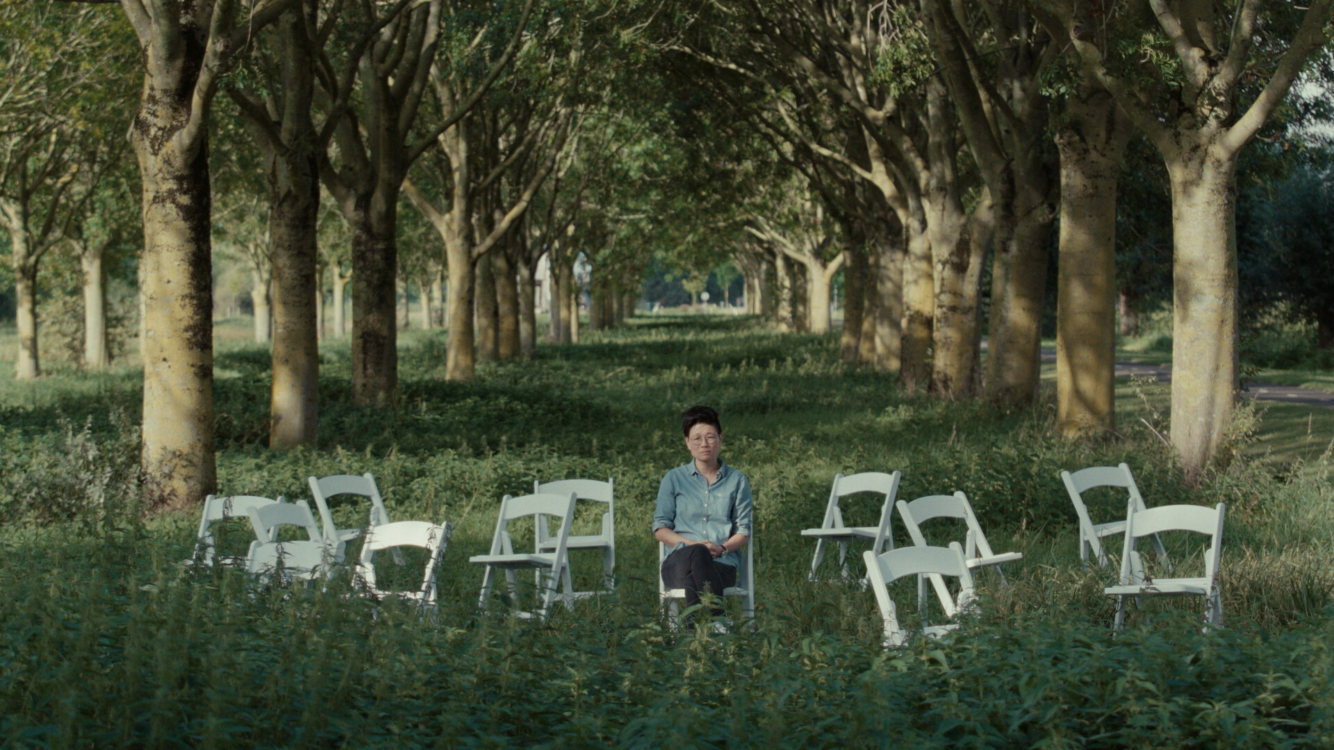 Photo 2 BETWEEN_GOODBYES_KeyStill__M_with_empty_chairs