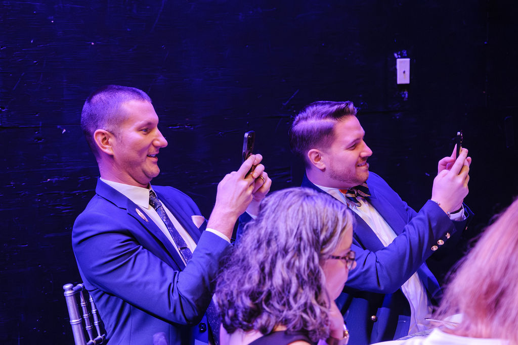 Patrons taking picture of the puppets at dinner