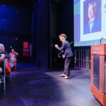Bill Irwin performing a dance on stage