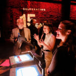 Patrons using shadow puppets