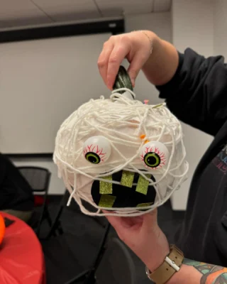 It’s the great pumpkin, ArtsEmerson! Our staff decorated pumpkins this week and here are our top three, in order! 

Image descriptions: 
Image one: pumpkin covered in white yarn with eyes
Image two: pumpkin with clay eyes, mouth and earrings
Image three: pumpkin with black and white paint, ears and whiskers (a cat)

#Halloween #Pumpkin