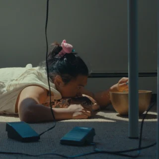 The Boston Asian American Film Festival is almost here! Check out the Shorts Program lineup, which features the following shorts blocks: Oh Queer, Don't Tell Your Parents, Childhood Wonders, Bridging Two Worlds, Bittersweet 16 and Not Your Model Minority. ⁠
⁠
🎟️ Get tickets at the link in our bio.⁠
⁠
Image descriptions:⁠
Image 1: Someone lying on the floor eating food⁠
Image 2: A woman with her arms crossed⁠
Image 3: Black and white photo of people looking at a tower⁠
Image 4: Building that says "Kowloon." ⁠
Image 5: Person with a surf board and bicycle ⁠
Image 6:  Person with glasses and shoulder length hair⁠
⁠
#BAAFF #BostonFilm #FIlmFestival #BostonEvents #BosArts