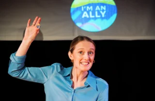 You're only an ally if you come see this show! Tickets are selling fast, so get yours now.⁠
⁠
🎟️ in bio!⁠
⁠
#DisabilityLedTheatre #SatireTheatre #ComedicTheatre #Satire #BostonTheatre⁠
⁠
ID: Company member wearing a blue blouse, hair pulled back, holding a button that says 'I am an ally." Close up of button projected onto the screen behind her.